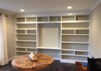 Dining room shelf units with a work area in the center section. The wood we send is polar and is 1 1/2” thick with recessed dado grooves notched into the uprights to hold the shelves. The paint we used was acrylic latex to match the homeowners paint.