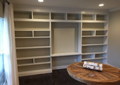 Dining room shelf units with a work area in the center section. The wood we send is polar and is 1 1/2” thick with recessed dado grooves notched into the uprights to hold the shelves. The paint we used was acrylic latex to match the homeowners paint.